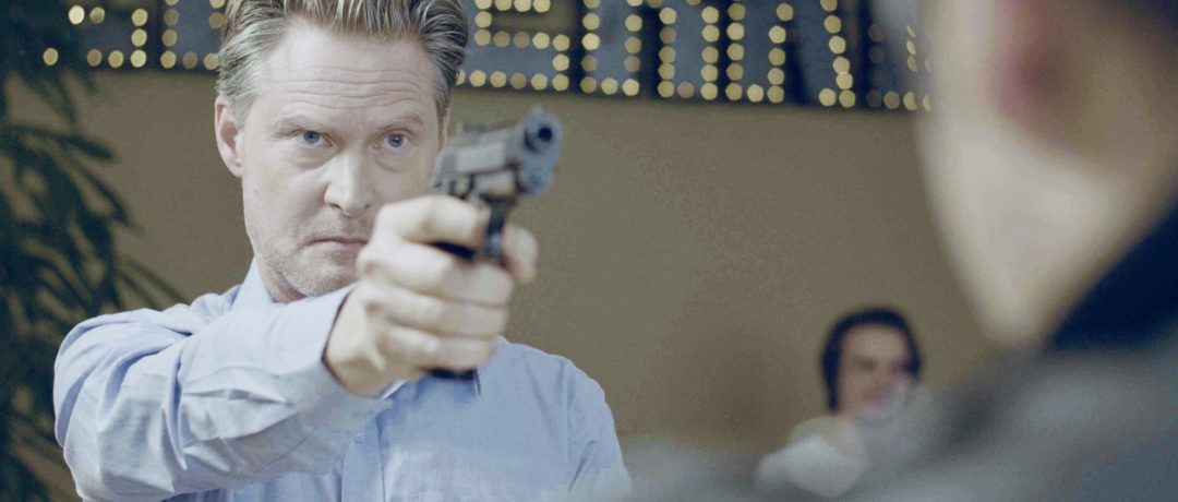 Actor Henrik Norman as Gunman